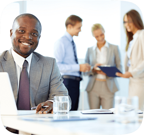 executive-smiling-with-laptop